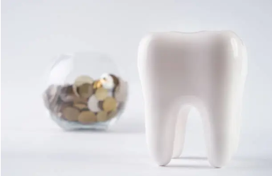 image of tooth and coins